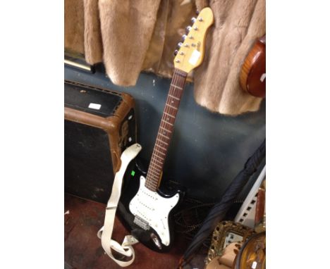 AN ENCORE ELECTRIC GUITAR. R
