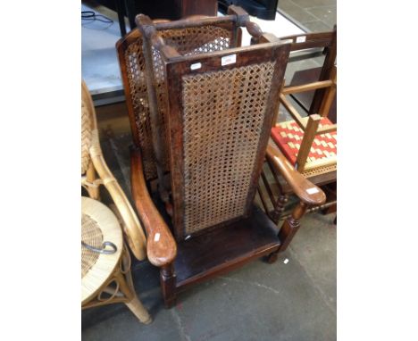 A BERGERE BACKED CHAIR AND BERGERE STOOL