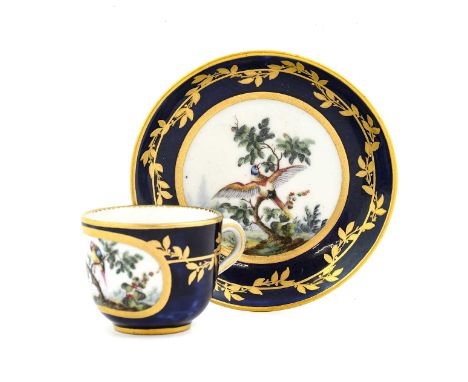 A Sèvres Porcelain Miniature Tea Cup and Saucer, circa 1765, painted in the manner of Ambroise Michel with exotic birds in br