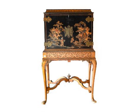 ^  A 1920s/30s Walnut and Parcel-Gilt Cocktail Cabinet on Stand, with removable tray top above a gilded pagoda moulding, two 