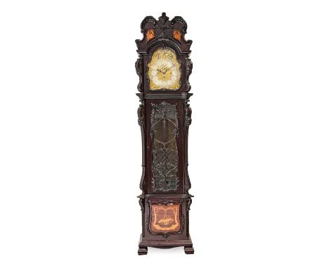 {} An Edwardian Mahogany Tubular Bell Chiming Longcase Clock, the elaborately carved case with leaf, scroll and swag decorati