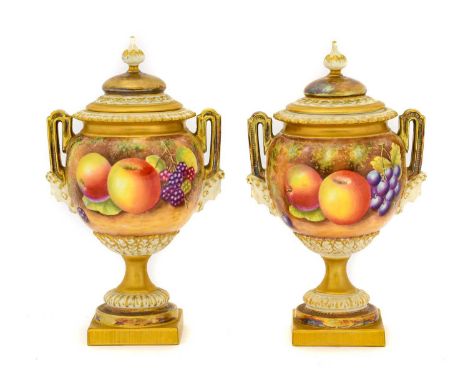 {} A Pair of Royal Worcester Porcelain Vases and Covers, 2nd half 20th century, by Leaman, of baluster form, the angular hand