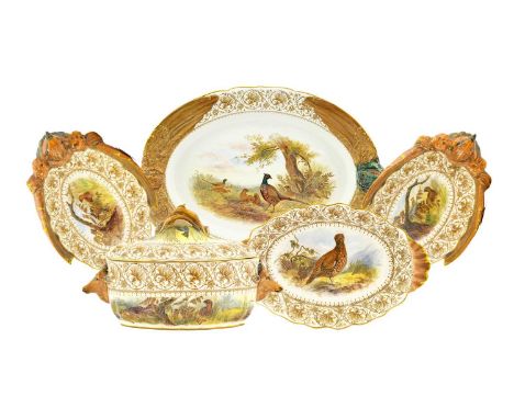 A Royal Worcester Vitreous China Game Service, 1896/7, decorated with game birds in landscape within foliate scroll borders, 