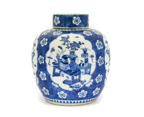 {} A Chinese Porcelain Ginger Jar and Cover, in Kangxi style, painted in underglaze blue with precious objects in panels on a