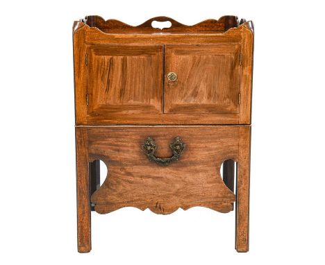 ~  A George III Mahogany Night Table, 3rd quarter 18th century, the tray top with pierced handles above cupboard doors, the d