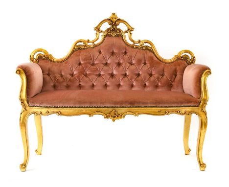 {} A 20th Century Glltwood Sofa, in Louis XV style, of attractive proportions, covered in buttoned pink close-nailed fabric, 