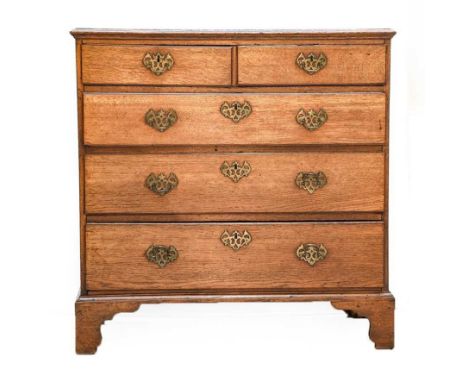 A George III Oak Straight Front Chest of Drawers, 3rd quarter 18th century, the moulded top above two short and three long gr