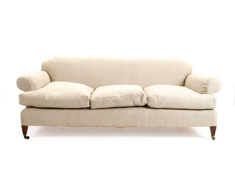 A Howard-Style Feather-Filled Three-Seater Country House Sofa, recovered in light grey fabric, with rounded arms and three sq