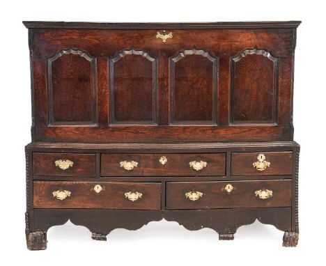 ^  A George II Joined Oak Chest on Stand, mid 18th century, the moulded hinged lid enclosing a vacant interior above four fie