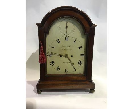 An 19th century mahogany bracket clock, James McCabe, Royal Exchange. London with break arched painted dial with strike silen