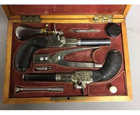 A Pair of quality 19th Century Percussion Travelling Pistols in original burr walnut  case, the cover with brass plaque engra