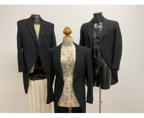 Three vintage wool frock coats. Various sizes.