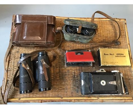 Pair of vintage camera together with a set of vintage field binoculars and a pair of opera glasses
