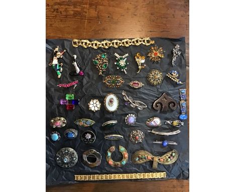 Various items o costume jewellery from the 1920s -1970s including 1960s gold coloured bracelet and a 1970s gate gold coloured