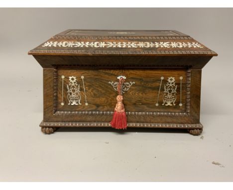 A good quality Regency mother of pearl inlaid rosewood tea caddy with fitted interior, ring handles and carved  bun feet.W:36