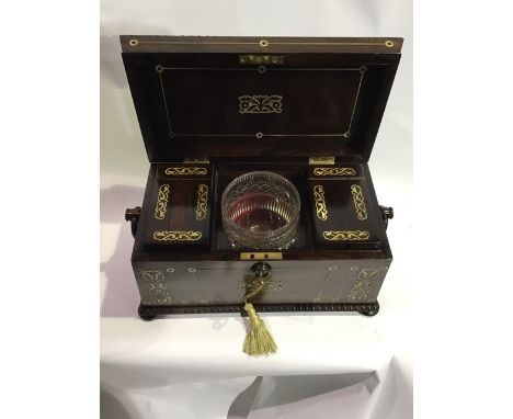 A good quality Regency brass inlaid rosewood tea caddy with fitted interior, ring handles and bun feet. W:33cm x D:18cm x H:2