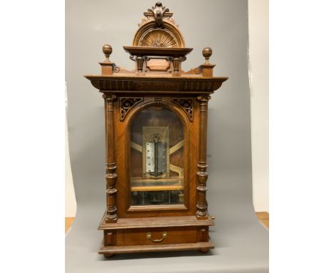 A late 19th early 20th century mahogany cased Polyphon, penny operated, table top, with single drawer, with approximately 30 