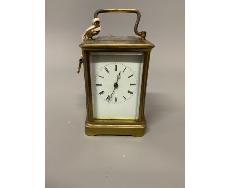 A gilt brass carriage clock. W:9cm x D:8cm x H:12cm
