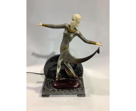 A patinated metal figural table lamp after a model by Josef Lorenzl, modelled as a dancer holding a scarf, on veined marble b