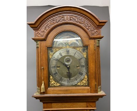 A Fine carved oak  three train musical longcase clock,on a plaque to the centre above six o'clock, with subsidiary seconds di