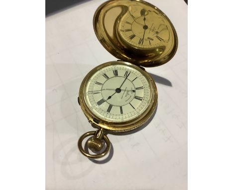 A late 19th century 18ct gold chronometer full hunter pocket watch. White enamel dial with with gilt crown wind movement sign