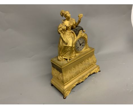 A French gilt metal mantle clock. W:30cm x D:13cm x H:40cm