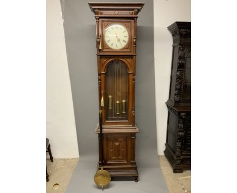 A large 20th century oak longcase clock, the case with arched glazed door. Triple weight chiming on a gong with modern replac