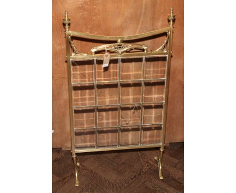 Victorian brass fire fender and a brass and glazed fire screen
