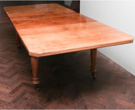 Large Edwardian style light oak extending dining table with two centre leaves