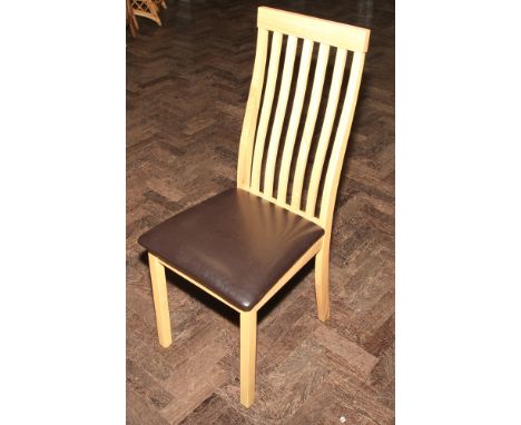 Set of six light oak finished dining chairs with slat backs and leather upholstered seats 