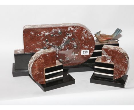 French art deco designed 3 piece rouge and black marble clock garniture decorated with bird 