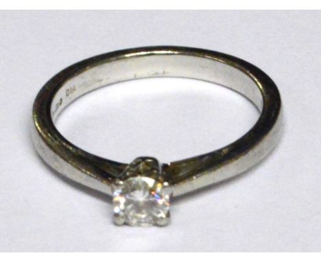 A platinum and diamond solitaire ring with pierced shoulders, stone approx 0.2cts, size K, approx 4g. CONDITION REPORT: Scrat