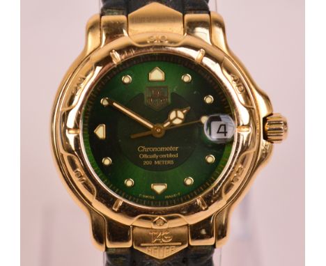 TAG HEUER; a gentleman's 18ct gold wristwatch, the green dial set with date aperture and inscribed "Chronometer, Officially C