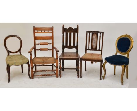 A Victorian mahogany spoon back upholstered chair, a similar gilt painted example, two further chairs, and a ladder back rush