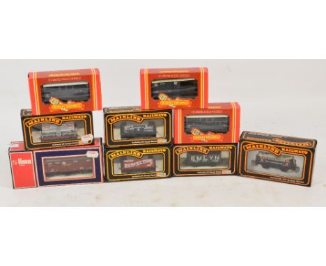 A collection of Hornby and Mainline OO gauge scale models of carriages and wagons, also a boxed Lima carriage, and a boxed Da