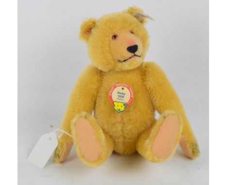 A boxed Steiff Dicky teddy bear, no.407581, with numbered white and black tag to ear, with short blonde mohair fur, with pres