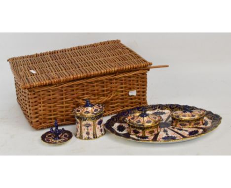 A late Victorian Royal Crown Derby Imari 1128 pattern dressing table set comprising a shaped oval tray, length 33cm, three li