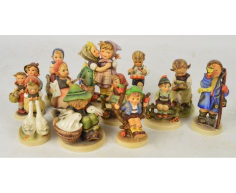Twelve Goebel Hummel figures.