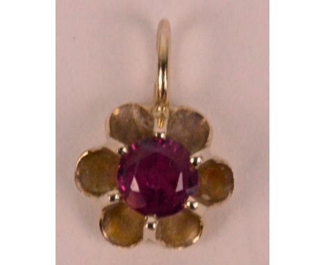 A small 9ct yellow gold pendant set with a circular ruby weighing approximately 0.25cts.