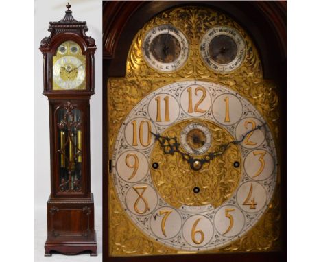 An Edwardian mahogany tube chiming longcase clock, the carved caddy pediment above arched door set with silvered chapter ring