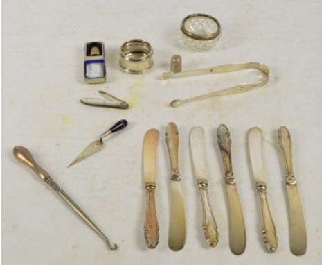 a mixed lot of silver items comprising a pair of Georgian hallmarked silver bright cut sugar tongs with rubbed marks, possibl