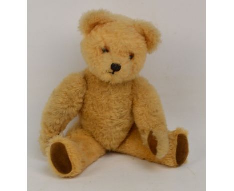 A vintage Chiltern type musical wind-up lullaby bear with beige plush fur and velveteen paws, height 36cm.