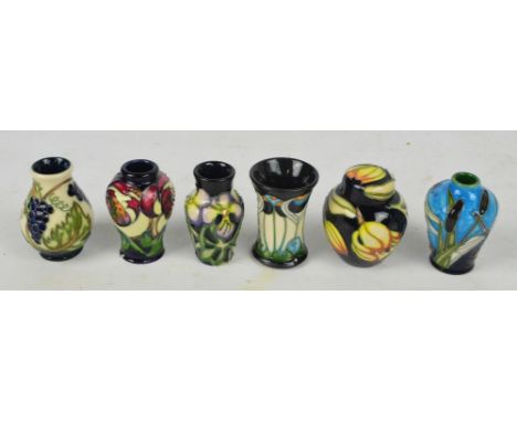 A set of six modern Moorcroft miniature ceramic vessels including ginger jar, flared vase, baluster vases, etc, all in presen