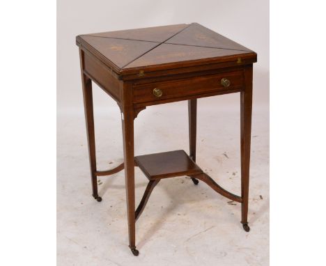 An Edwardian mahogany envelope card table, the outer leaves inlaid with flowers surrounded by string inlay, the inner leaf su