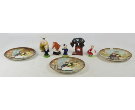 A mixed lot of decorative ceramics including three Royal Doulton moulded plates, a Royal Doulton figure; HN2167 "Home Again",