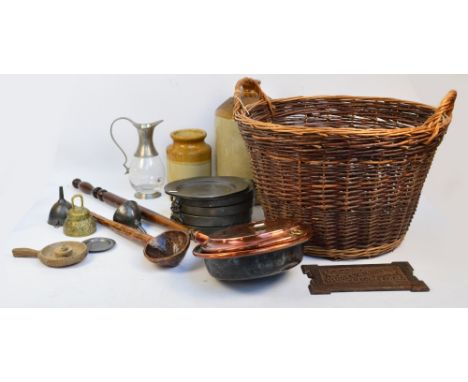A group of pewter items including four warming plates, two further plates, two funnels, a pewter mounted clear glass jug, als