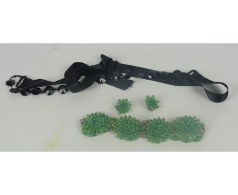A vintage 1950s green acrylic necklace with four cactus-like plaques suspended on green beads and a pair of matching earrings