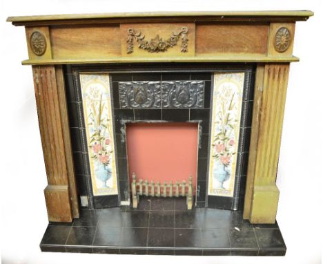 A tile set fire insert with wooden surround, width 142cm (surround af).