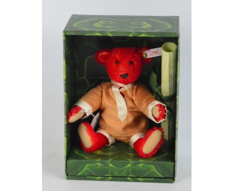 A boxed Steiff Baby Alfonzo teddy bear no.653773, with numbered white and red tag to ear, with clipped red mohair fur, in Cos