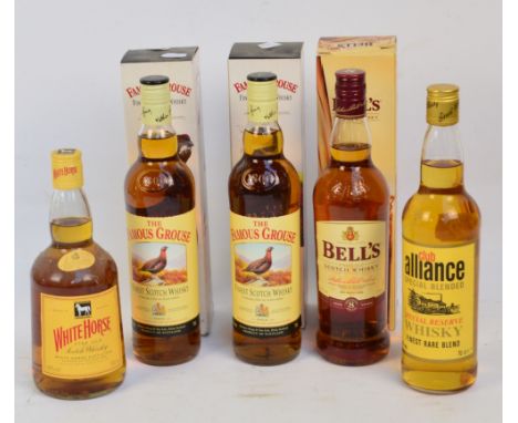 Two boxed bottles of The Famous Grouse Scotch Whisky, a boxed bottle of Bell's Scotch Whisky, a bottle of White Horse Scotch 